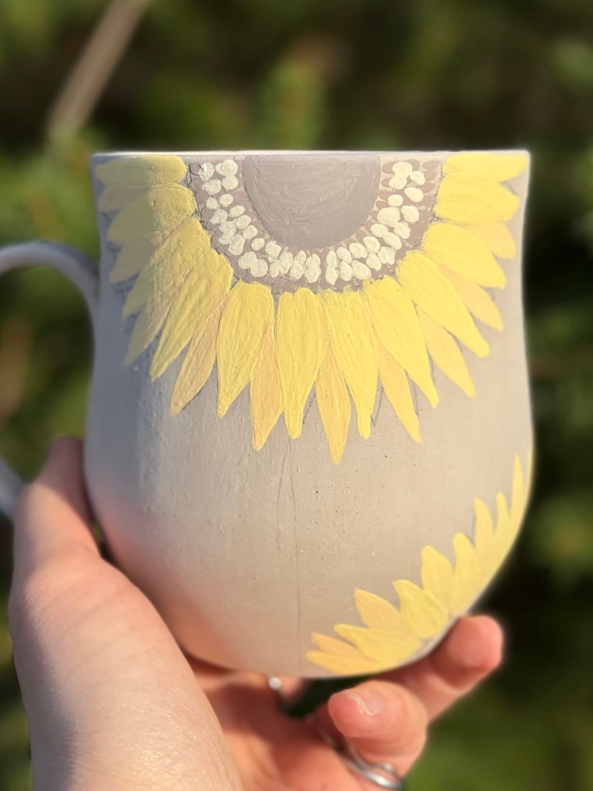 Sunflower mug fully painted before firing